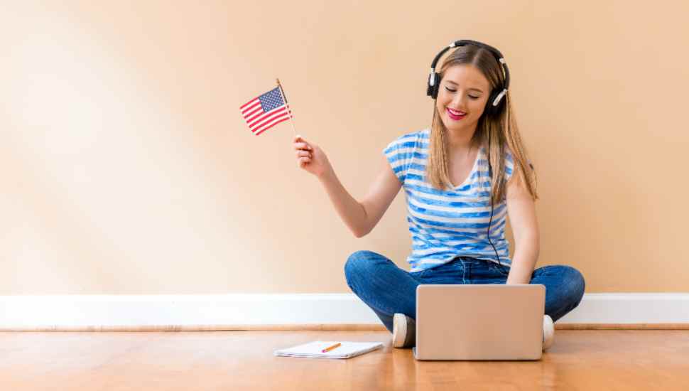woman holding flag with computer