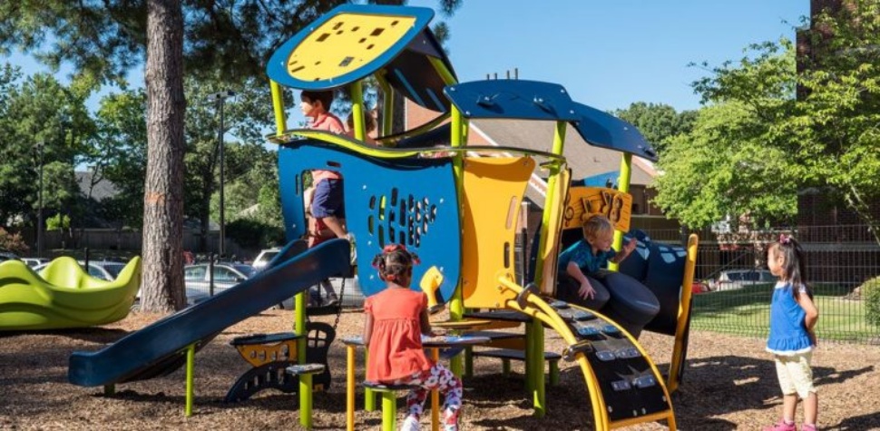 Kids playing on playground equipment.