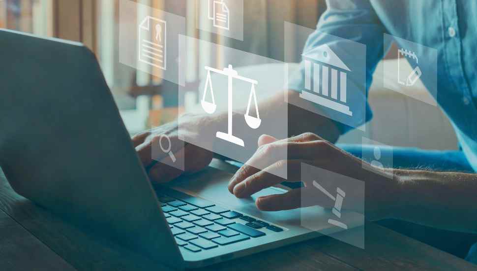 man at computer with icons