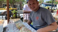 man at picnic table