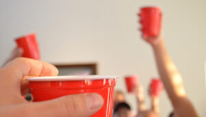 red cups held aloft