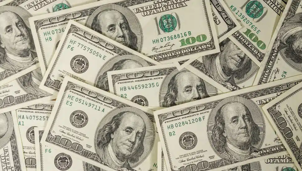 Hundred Dollar bills laid on a table