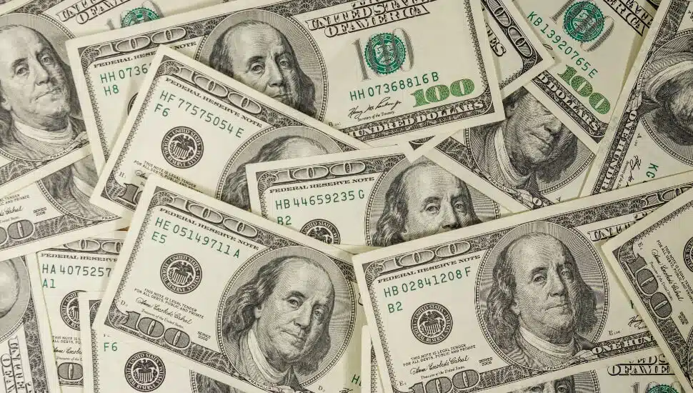 Hundred Dollar bills laid on a table