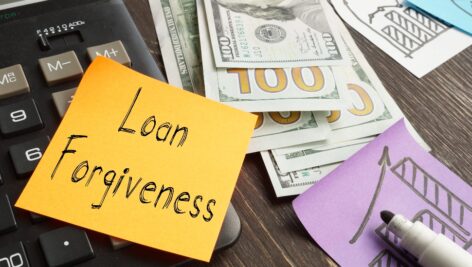 Loan forgiveness is shown using a sticky note