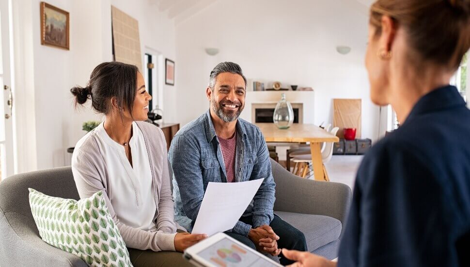 a young couple with their financial planner