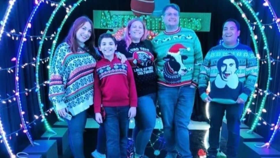 family visiting the Christmas House