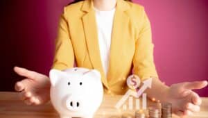Businesswoman with rows of coins with graph for finance and business concept. coins with piggy bank. Save money for prepare in the future. account finance bank business.