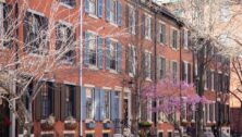 Rows of brownstone apartment buildings in Center City with windows, stoops and planters in Pennsylvania
