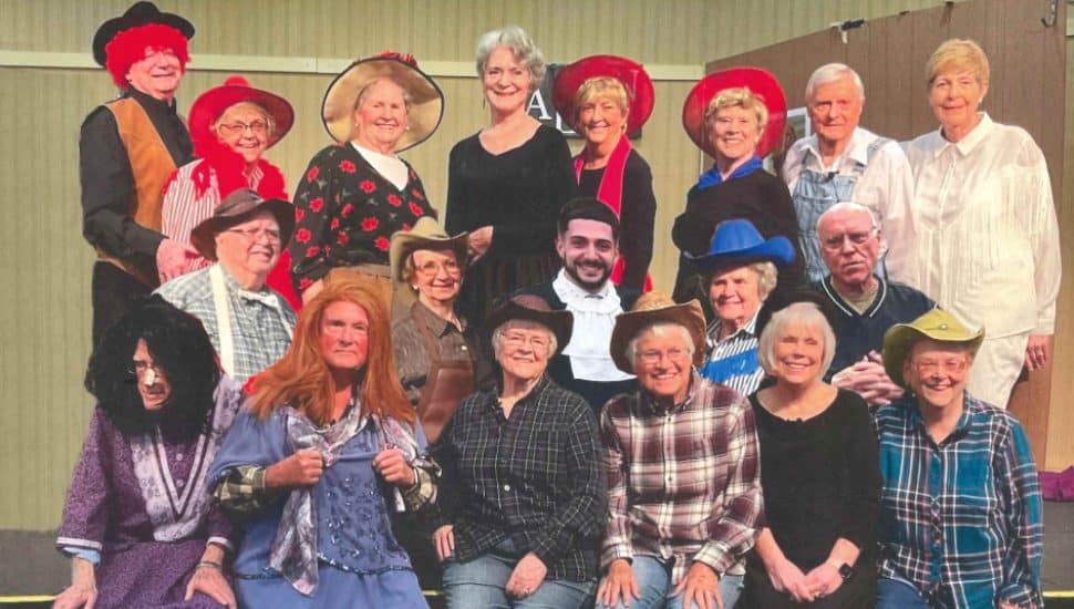 The Village Player performers in a production of Way Out West in a Dress