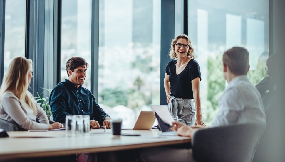 A woman executive leads a conversation in a conference room