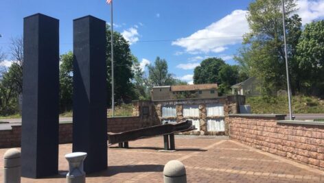 A 9/11 memorial in Warminster, with a piece of the World Trade Center in the foreground