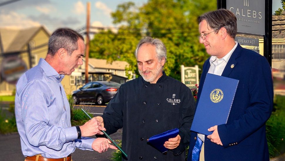 Senator Steve Santarsiero and Representative Tim Brennan with restaurant owner Caleb Lentchner