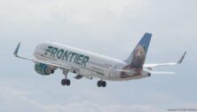 A Frontier Airlines plane in the sky