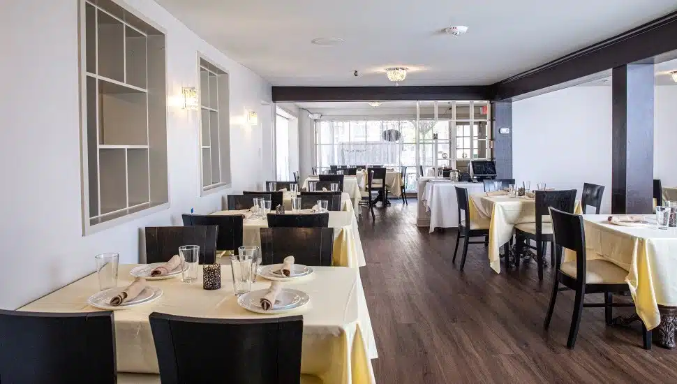 Tables set up in the dining room of Guru's Indian Cuisine