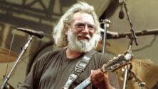 Jerry Garcia performing with a guitar
