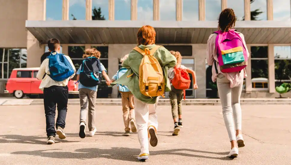 Students walking into a school.