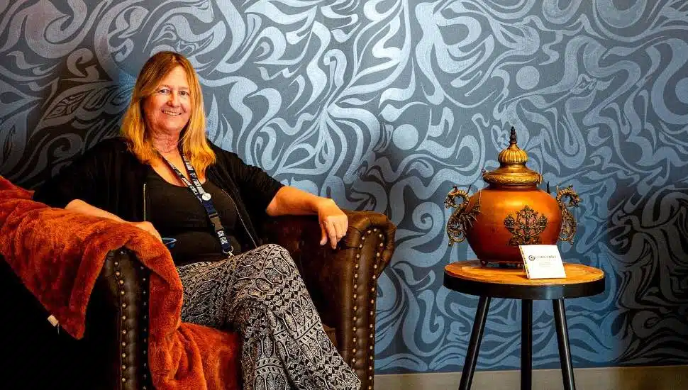 Laurie McHugh sitting in a chair.
