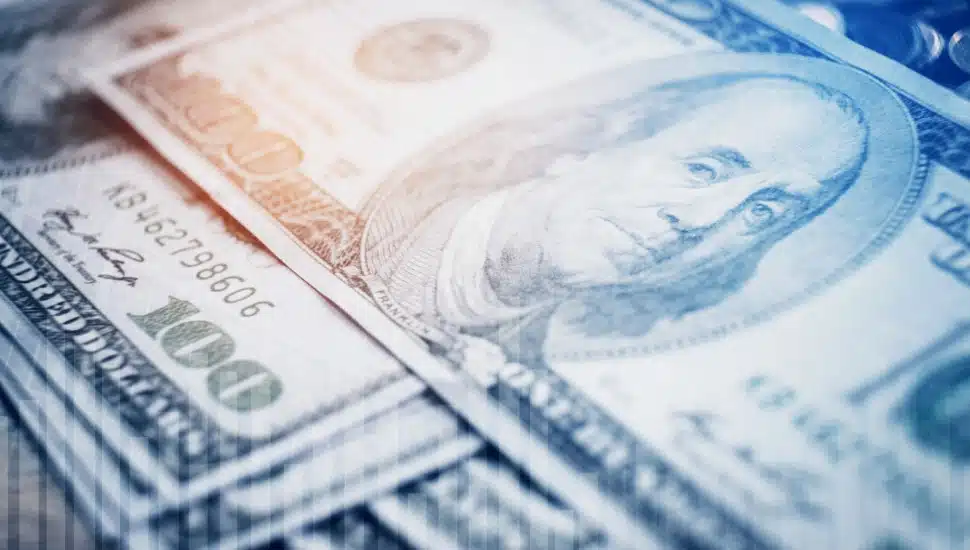 $100 bills stacked on top of each other