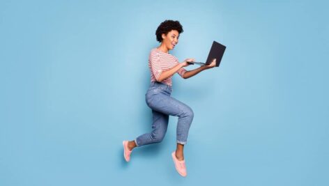 person in the air with laptop