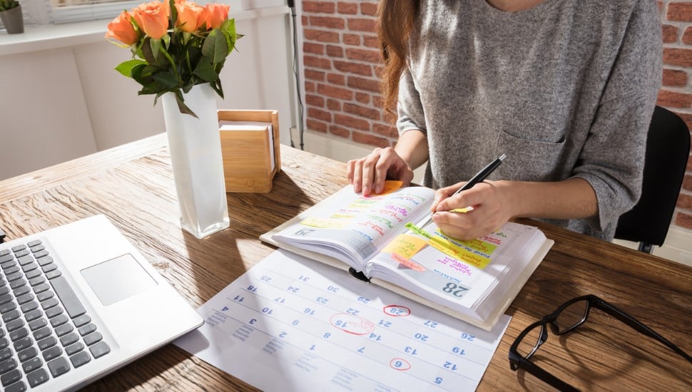 person setting reminders calendar