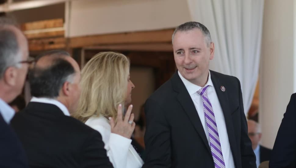 Brian Fitzpatrick shaking hands with a group of people