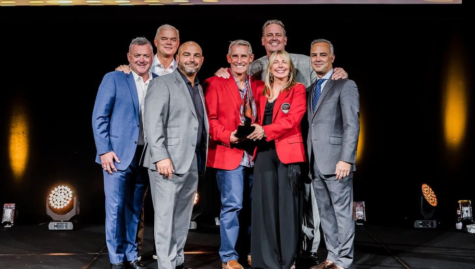 Cheryl Stradling and Greg DeCinque accept the annual Intelisys award given to top national partners – “Platinum TPC Award”.