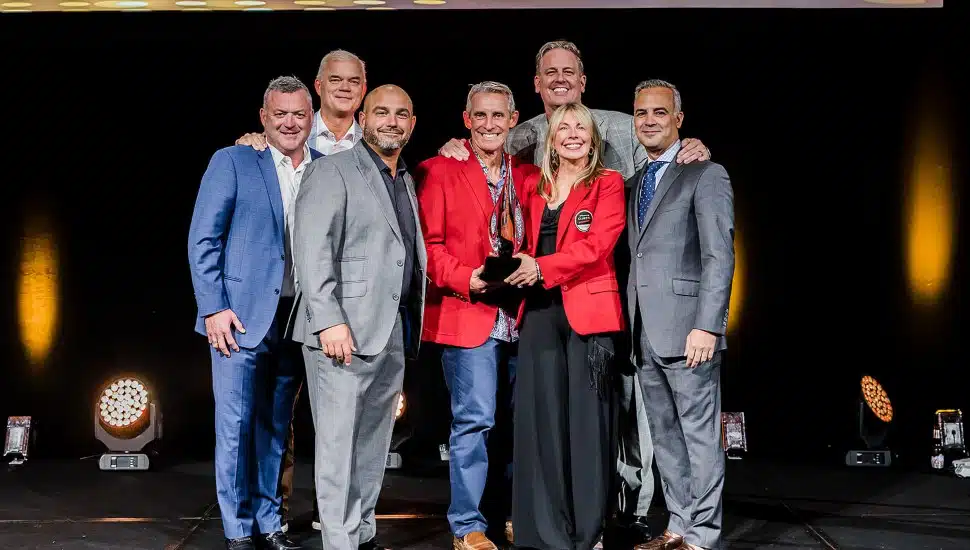 Cheryl Stradling and Greg DeCinque accept the annual Intelisys award given to top national partners – “Platinum TPC Award”.