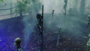 Plastic skeletons laid out in a fog at Sleepy Hollow Haunted Acres