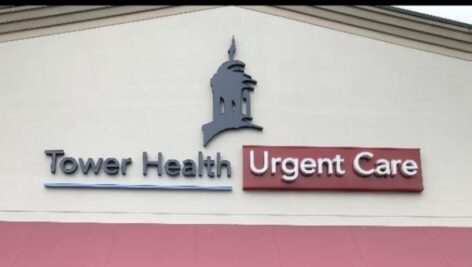 A sign for Tower Health Urgent Care