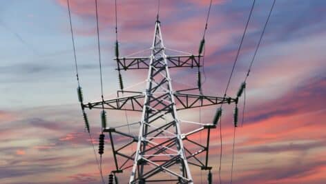 Electricity pylon (high voltage power line) against the background of a romantic evening sky