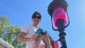 founder Keith Fenimore adding a pink filter to a street light