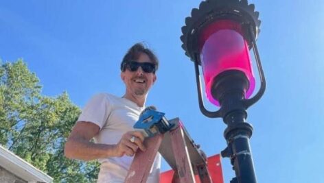 founder Keith Fenimore adding a pink filter to a street light