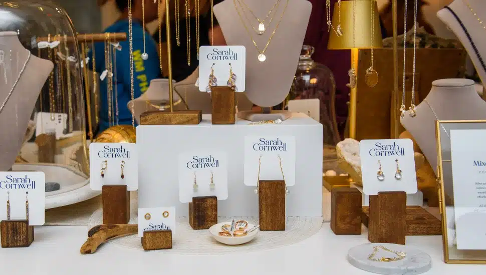 A window display of Sarah Corwell Jewelry.