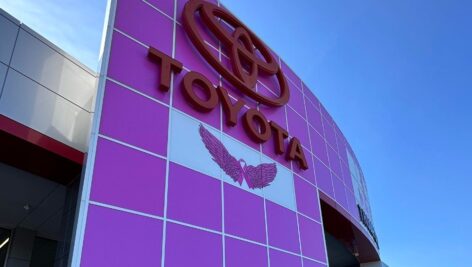 The exterior of Thompson Toyota with pink lights
