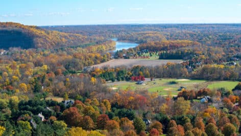 Birds eye view of fall foliage in Bucks County with Delaware River