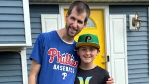 Michael Schaefer and 12-year-old stepson Maverick bower in Phillies gear