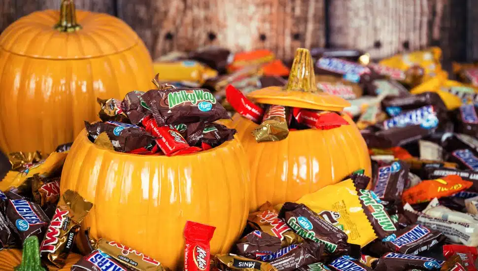 Decorative pumpkins filled with assorted Halloween chocolate candy made by Mars, Incorporated and the Hershey Company.