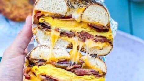 heart attack bagel sandwich includes eggs, cheese, and porklroll