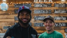 Eagles player D’Andre Swift at Bald Birds Brewing, located in Audubon, with owner Abby Feerrar.