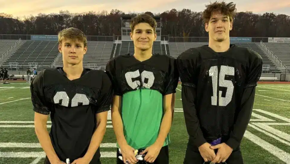 Pennridge football safeties Joe Hamburger, Sam Kuhns, and Joe Gregoire on football field