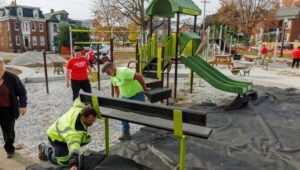 Volunteers from the Hanover community work on upgrades to Wirt Park, guided by General Recreation, Inc. in Newtown Square.