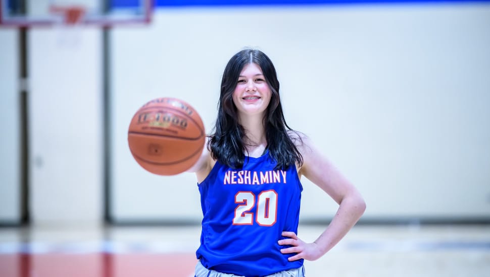 Emma Candy on court with basketball