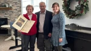 Evie Dugan, 90-year-old volunteer at Warminster Fodo Bank with food bank's executive director Mike Cerino and and Amanda Soloway, who was representing State Rep. Brian Munroe.