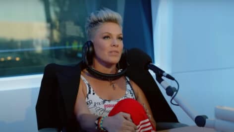 Pink sitting in interview