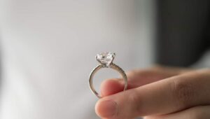 Hand holding a diamond ring