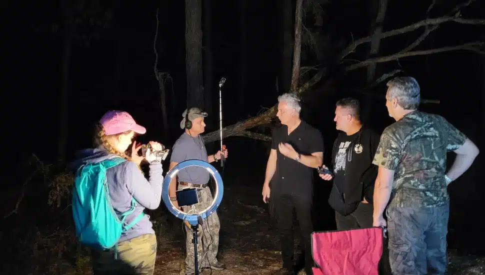 Eric Mintel and crew at woods in the night with ring light, camera and boom mic