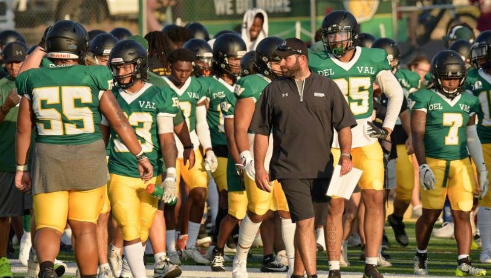 Coach Mike Isgro with football team