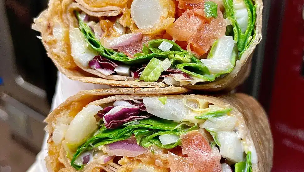 close up of vegan wrap cut in half at Sprig & Vine
