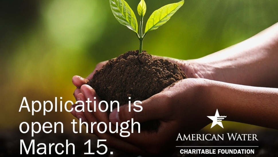 hands holding fresh dirt and plant promoting the American Water Foundation