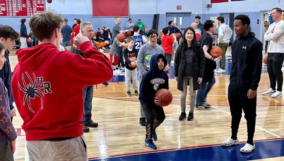 Junior Firebirds on basketball court at Holy Ghost Prep